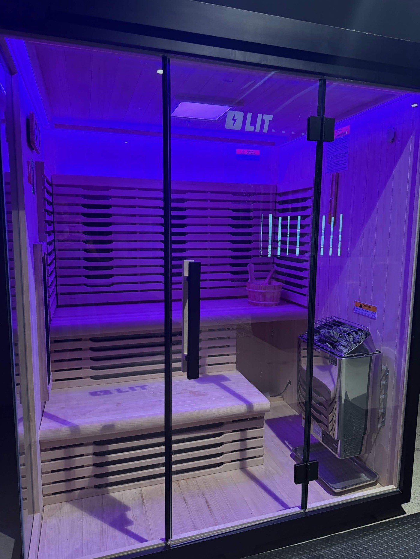 Dual sauna cabin glowing with soft light